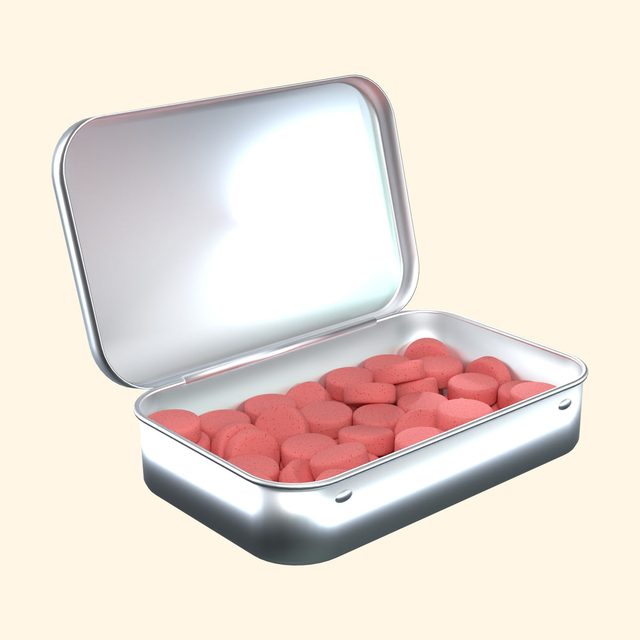 Watermelon caffeinated mints in an open tin